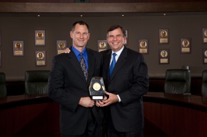 Scott Vogel receives the Technology award from Emerson Chairman and Chief Executive Officer David Farr.